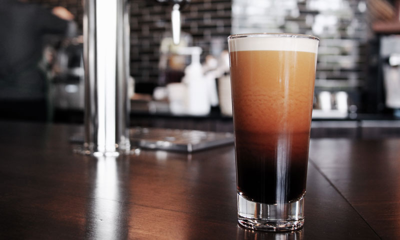 Tall frothy glass of nitro